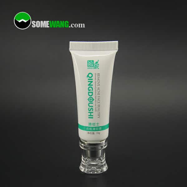 Tube of Diameter 22mm cosmetic soft tube with offset printing silk screen printing on a reflective surface, with the brand and logo visible, against a neutral gray background.