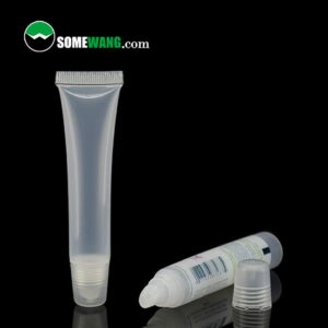 Two small clear plastic squeeze tubes on a reflective surface, one standing upright and the other lying down, both empty with a Diameter 16mm lip stick soft PE tube with lip stick plug with offset printing logo visible.