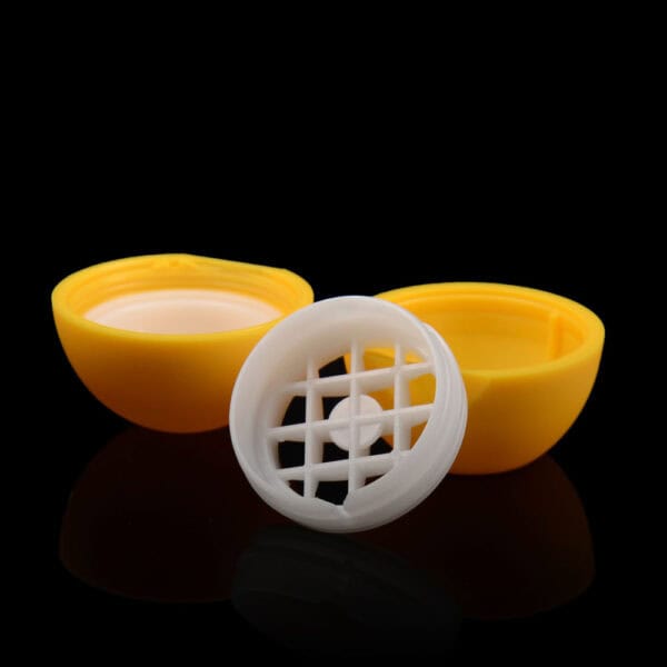 An opened 8g ball-shaped SWC-CLI008A lip balm with a white grid inside, shown against a black background.