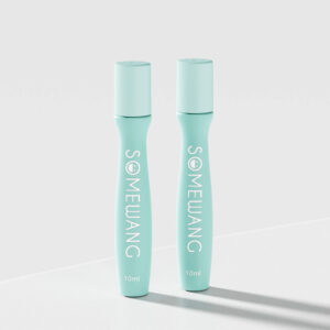 Two 15ml teal PETG cylindrical bottles labeled "SOMEWANG" stand on a white surface, ideal for eye cream roll-on use.