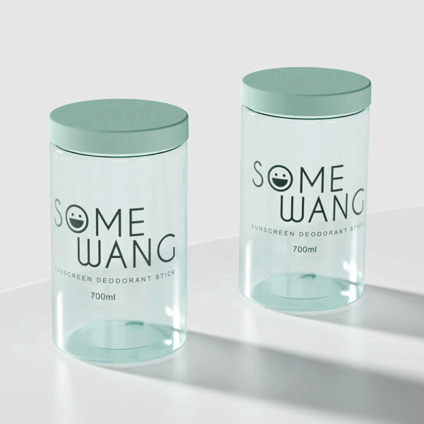 Two 700g milk powder-style containers with green lids labeled "SOME WANG Sunscreen Deodorant Stick" sit on a white surface.