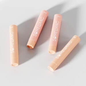 Soft pink lipstick tubes with "SOMEWANG" branding, minimalist design, and matte finish.