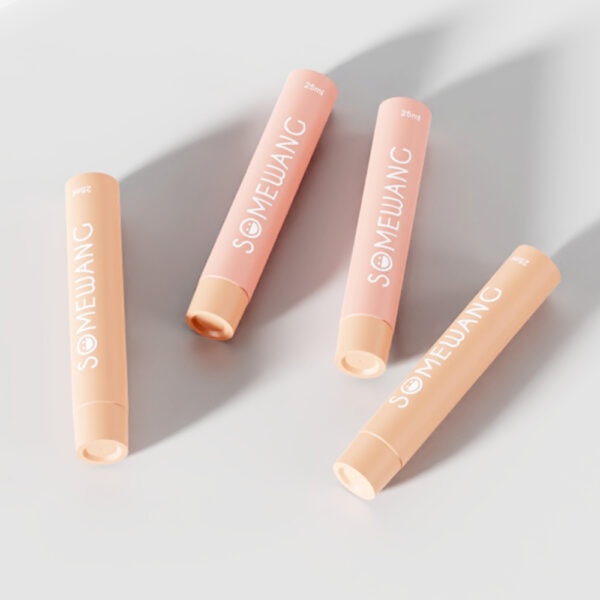 Soft pink lipstick tubes with "SOMEWANG" branding, minimalist design, and matte finish.