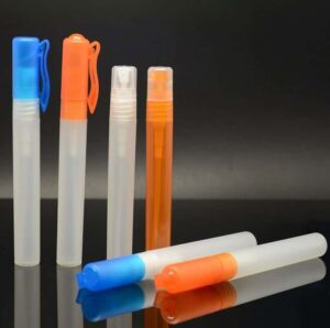 Ten 10ml Cute PP Pocket Pen Sprayer Perfume Bottles for Travel in varying sizes and colors, including blue and orange, displayed on a reflective surface with a dark background.