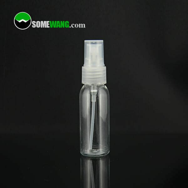 30ml Clear Plastic Bottles for Liquid with a white nozzle on a reflective black surface, labeled with the text "somewang.com".