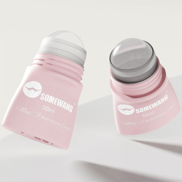 Two pink 50ml Mini Roll On Bottles from SOMEWANG with silver caps, ideal for essential oils, rest elegantly on a light surface.