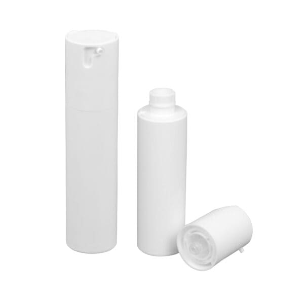 Three SWC-BPA15DG white cylindrical PP bottles are arranged elegantly: two upright, one lying down uncapped. Stylish and functional.