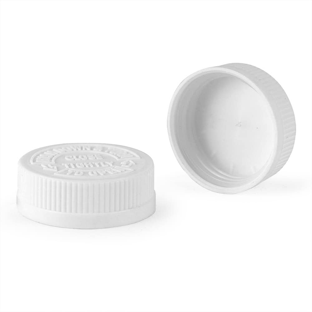 A pair of white 43mm child-resistant plastic caps is shown: one upright, one on its side. Both have ribbed edges and embossed text.