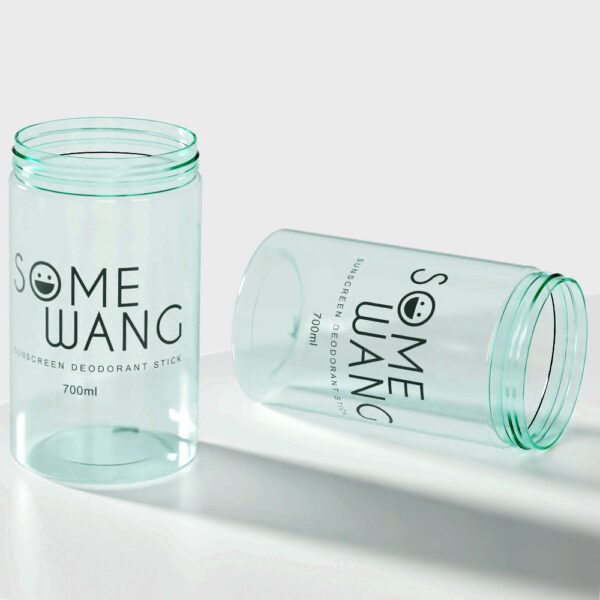 Two translucent green containers resembling 700g milk powder cans are labeled "SOME WANG" and "sunscreen deodorant stick.