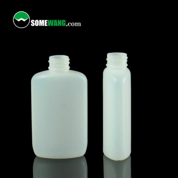 Two 60ML opaque white flat HDPE bottles with open tops on a dark background, labeled "somewang.com.