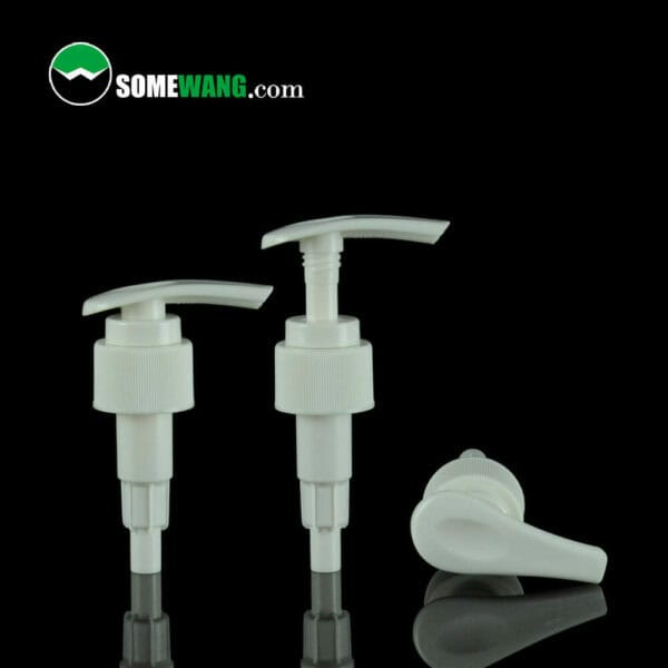 Three 24/410 plastic transparent lotion/cream pumps on a green background, with one lotion pump head lying horizontally, labeled "somewang.com.