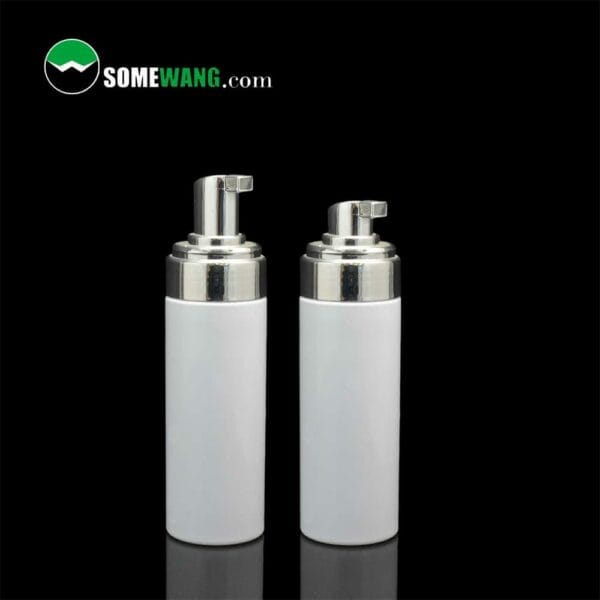 Two white cylindrical 200ml 42mm foam pump bottles with silver foam pumps on a black background, labeled "somewang.com.