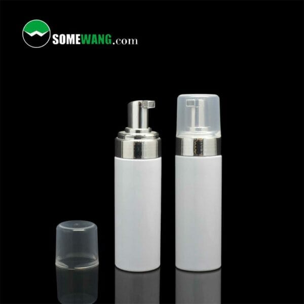 Two white 200ml 42mm foam pump bottles on a dark background, one with a cap, labeled "somewang.com.