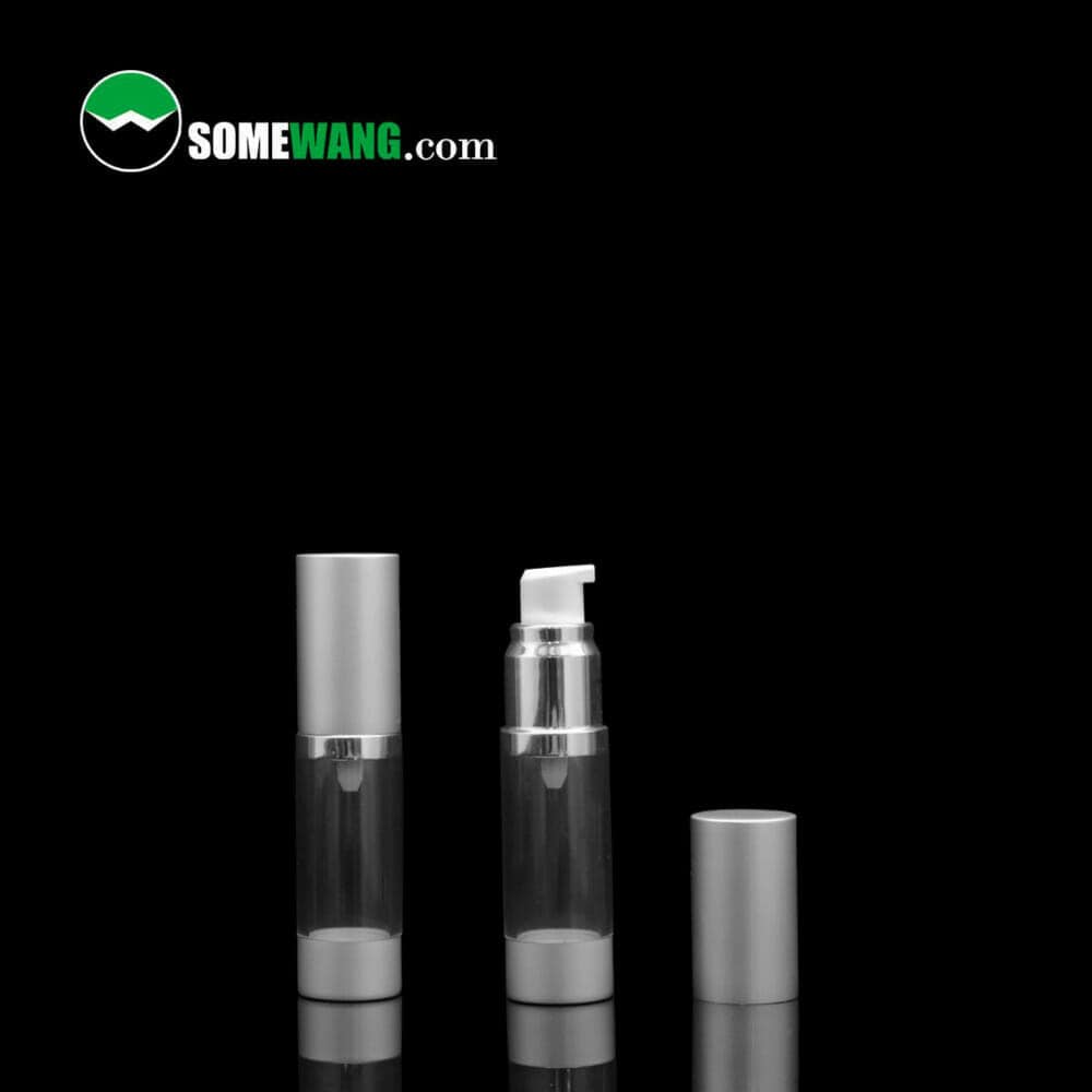 Two cylindrical clear plastic 120ml AS Material Airless Pump Bottles with silver airless pump dispensers and caps, on a reflective black surface, labeled "somewang.com".