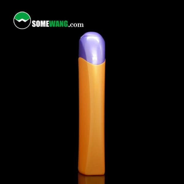 A vertical image of a 120ml empty orange and purple plastic shampoo bottle with a rounded cap, the logo "somewang.com" at the top.