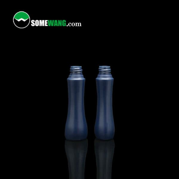 Two 60ml&650ml Blue Cosmetic Bottles on a reflective surface, with the logo "somewang.com" above them.