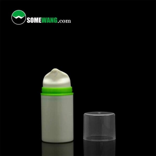 A white, SWC-BPA10 Plastic PP Cosmetic Airless Pump bottle with a green band and its translucent cap next to it, set against a black background with "somewang.com" logo at the top, resembling cosmetic