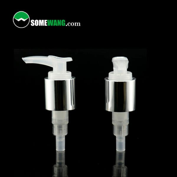 Two 24/415 cosmetic lotion pumps with aluminium shells for shampoo/cream/lotion closure, plastic lotion pumps with silver and white finishes against a reflective background, displaying the brand "somewang.com.