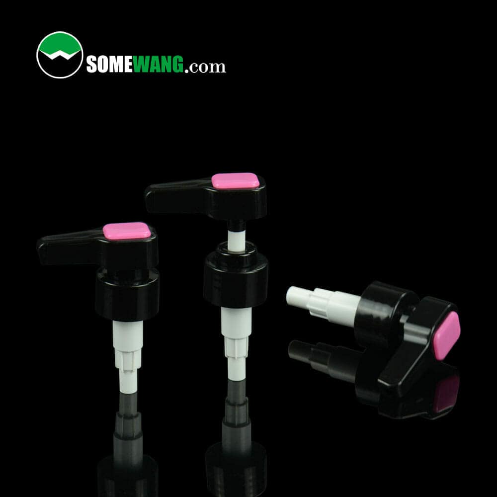 Three black 1cc Long nozzle Plastic Screw Lotion Pumps 28/410 with pink tops, displayed against a reflective dark background, with the website "somewang.com" visible.