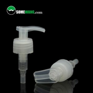 Two transparent nice design lotion pump dispenser tops from China 28mm for shampoo soap use on a reflective surface, with the logo "somewang.com" in the upper left corner.