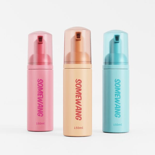 Three Somewang HDPE square bottles (90ml, 300ml) in pink, orange, and blue, each with a pump dispenser against a plain backdrop.