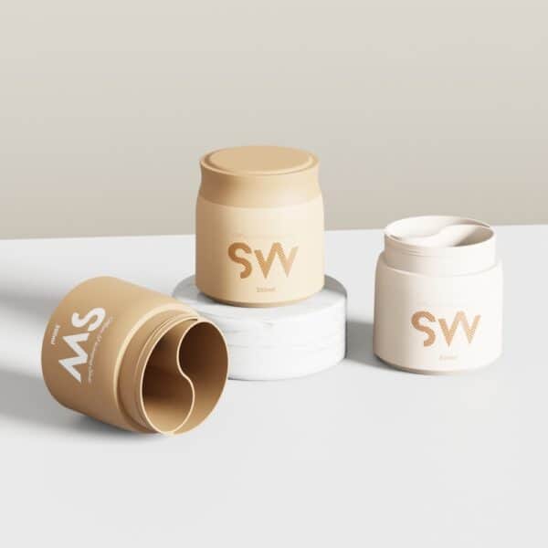 Three beige SWC-JP300BD 300g jars on a white surface, one sideways, one elevated on marble, all with "SW" branding.