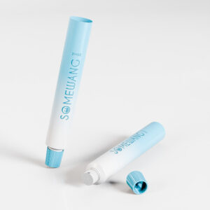 Two 22mm light blue/white food-grade ABL tubes with offset printing; one upright without a cap, the other lying down, cap off.