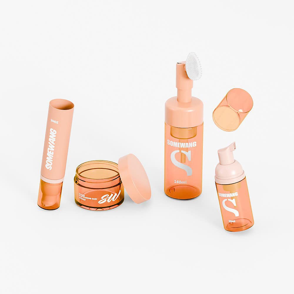 The "Somewang" set offers peach-toned skincare with a 30ml foam bottle, cream jar, brush tube, and open compacts.