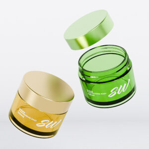 Two customizable PETG cream jars (15ml/50ml), gold and green, with lids floating on a white background.