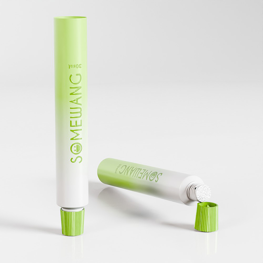 Two 22mm ABL tubes with green caps and offset printing rest on a white surface; one stands upright, the other lies down.