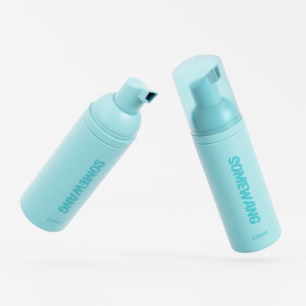 Two turquoise HDPE 90ml pump bottles labeled "Somewang" stand on a white background.