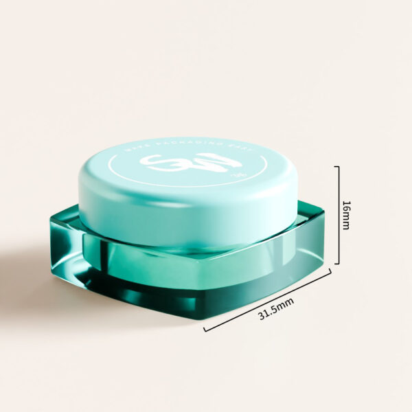 Hũ kem dưỡng mắt SWC-JPS3JS 3g màu xanh ngọc có nắp tròn, đáy lục giác, kích thước 31,5x16mm, trên nền sáng.