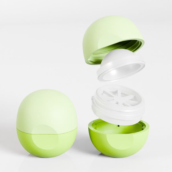 A dismantled green SWC-CLI008A 8g ball-shaped lip balm container is shown with another closed one on a white background.