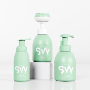 Three sleek green 450ML PET foam pump bottles labeled "SW" stand on a white surface, exuding charm for facial care.