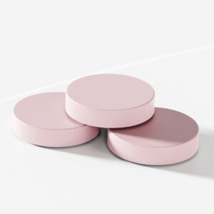 Three pink 56MM plastic mason jar lids with wide mouth screw caps are stacked on a white surface.