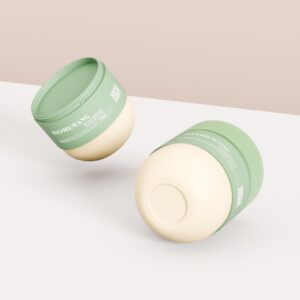 Auf einem weiß-rosa Hintergrund sind zwei grün-beige 270-ml-/9-oz-Tiegel mit Haarmasken von „Someyang“ abgebildet.