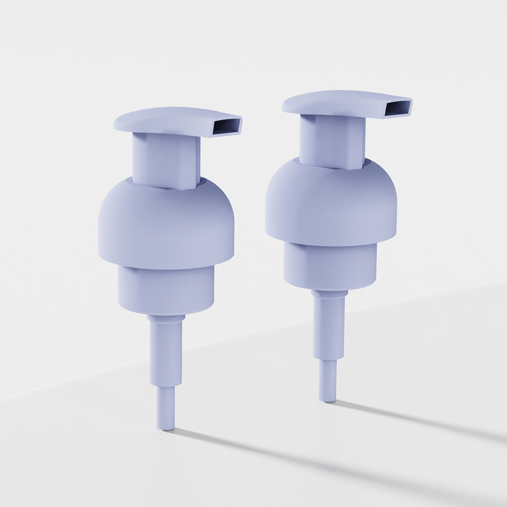 Two 40/410 PP foam pumps with internal springs stand upright on a smooth white surface against a plain background.