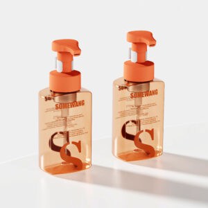 Two orange 200ml lotion bottles from "Wholesale Customized Round Shoulder Lotion Bottle" sit elegantly on a white surface.