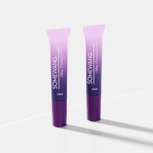 Two purple gradient tubes labeled "Wholesale Customized Lotion Bottle" for sleek cosmetic packaging sit on a white surface.