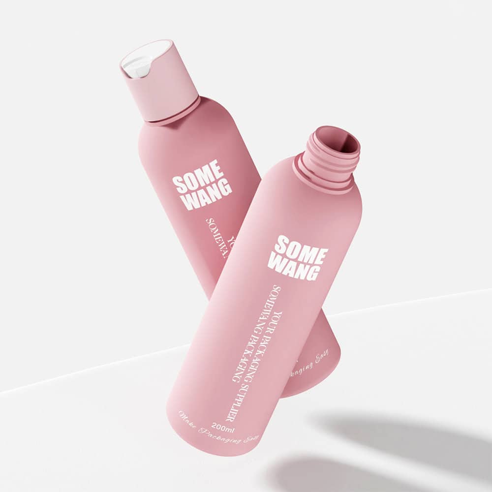 Two pink cylindrical bottles with white caps, one open and one closed, labeled "SOME WANG" for cosmetics on a white background.