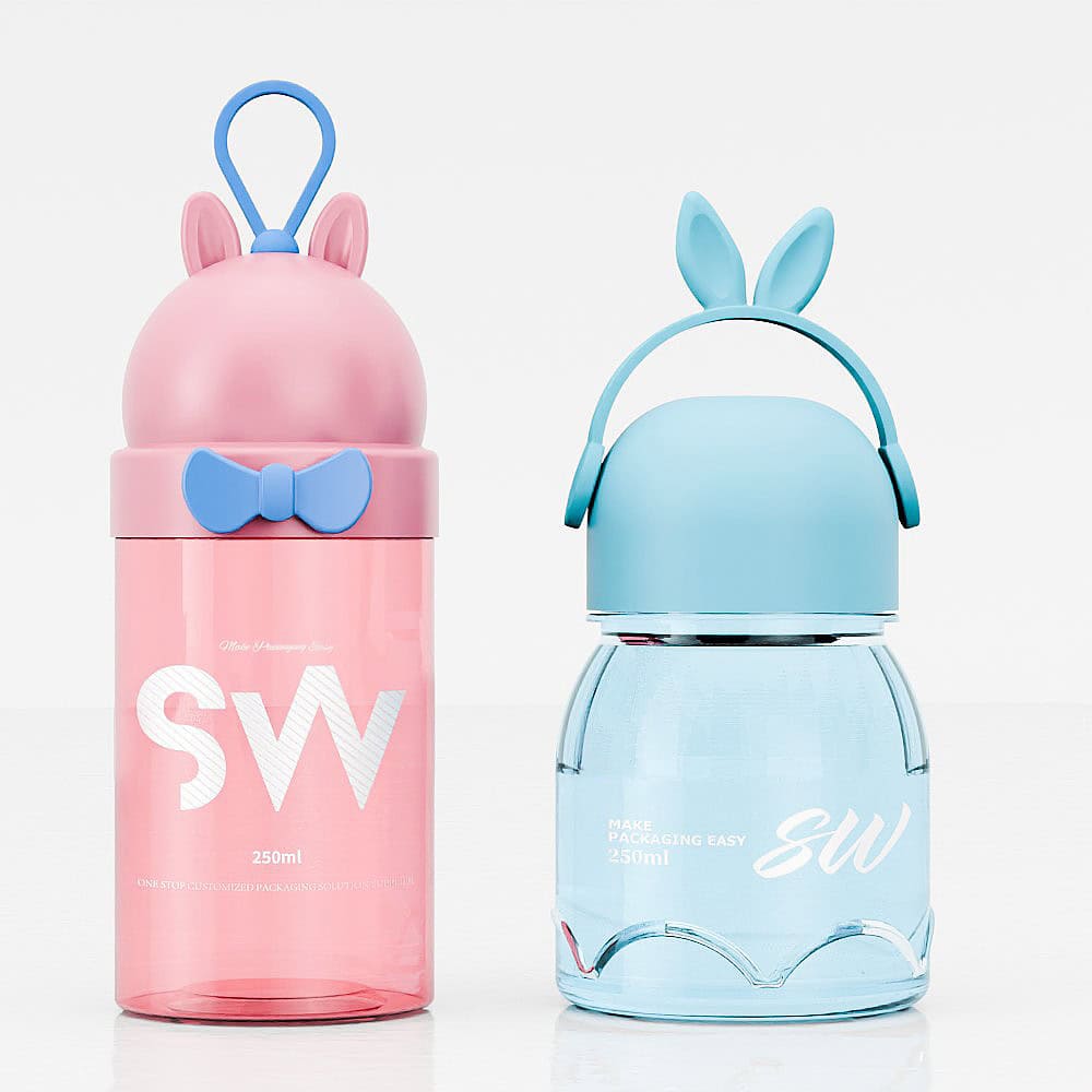 Two PET candy jars with cute animal lids: one pink with a blue bow tie, the other blue. Each holds 250 ml and features "SW" initials.