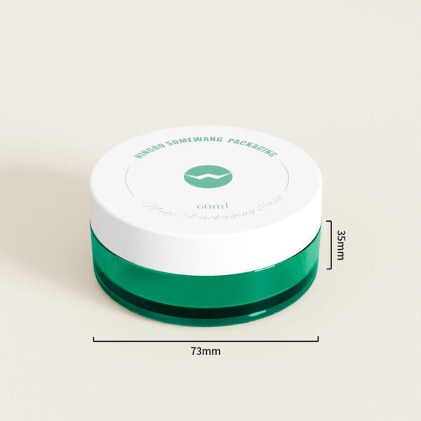 กระปุกครีม PETG ขนาด 30 ก./60 มล. (สีเขียวและสีขาว ขนาด 73 มม. x 35 มม.) ที่แสดงบนพื้นหลังสีอ่อน