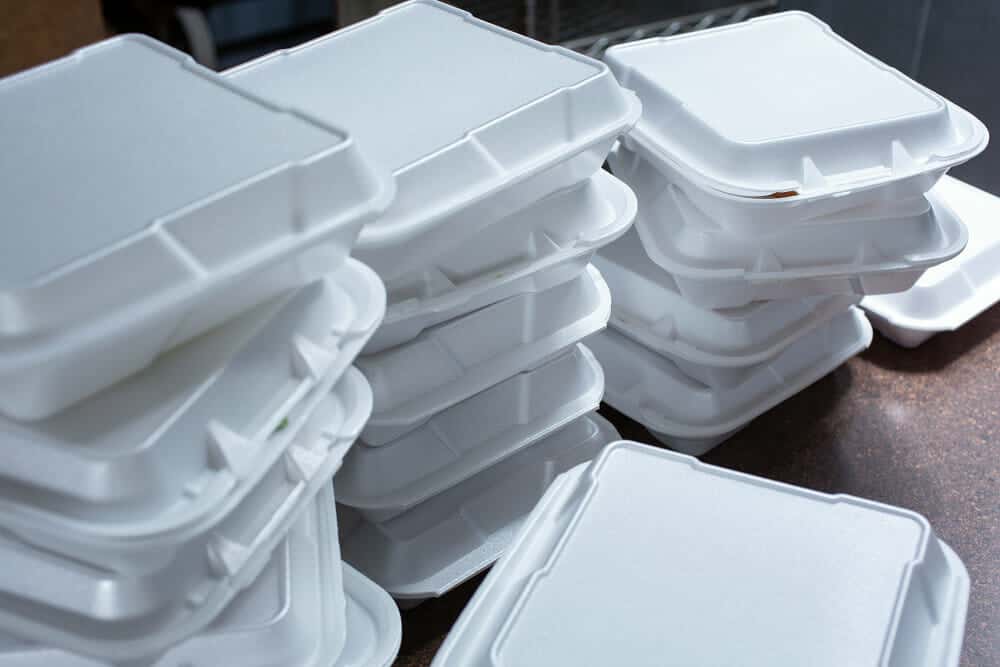 Styrofoam takeout boxes stacked outside the restaurant