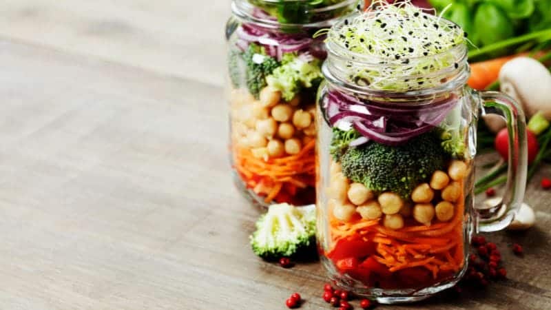The images provided depict glass jars used for storing and presenting food in a visually appealing manner. The jars are clear, allowing the colorful layers of the contents to be seen, which adds to the aesthetic appeal and can also serve as a way to entice people to eat healthy, homemade meals.