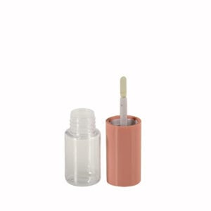 A transparent nail polish bottle with a peach cap is open, showing the brush. Its elegant design resembles high-end cosmetics packaging.