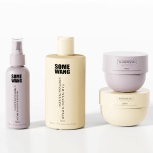 SOMEWANG" skincare set includes spray, lotion, and cream in customizable HDPE reusable bottles, elegantly displayed.