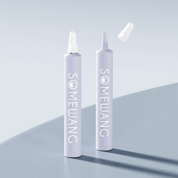 Two gray 15ml PE skincare tubes with "SOMEWANG" screen printing stand upright; one capped, one uncapped, on a gray surface.