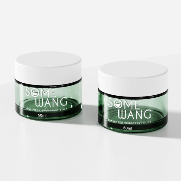 Two green 50ml glass jars with screw lids, labeled "SOME WANG SUNSCREEN DEODORANT STICK," elegantly shown on a white surface.