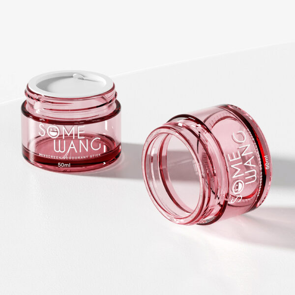 Two pink, transparent 50ml glass jars labeled "SOME WANG" sit on a white surface; one upright with a cap, the other on its side.