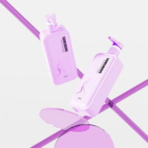 Two lavender pump bottles labeled 'Shampoo' and 'Conditioner' float with a 50ml glass jar against a minimal backdrop.